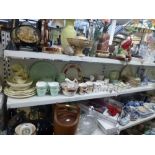 Two shelves of china including part tea services by Wedgwood, and Solian ware, a Limoges nine