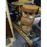 A carved wooden owl garden seat, a tripod wine table and four walking sticks. [on lot 886] FOR