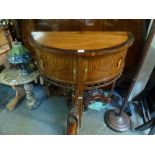 A charming 18th century Dutch demi-lune cabinet, cross-banded in rosewood, the pair of tambour