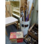 An aluminium litter bin/stick stand and contents plus a Philips Ultra Phil Heat Lamp [under s89] FOR
