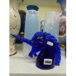 A Murano blue glass unicorn head signed by Archimede Seguso, 14 cm high, and a pair of tall