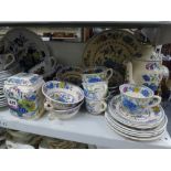 An extensive lot over three and a half shelves comprising a Mason's Regency pattern part tea