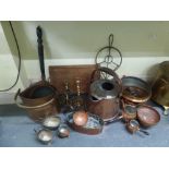 A quantity of copper and brass items including a watering can, copper hammered tray, coal scuttle,