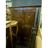 A fine George III elm cupboard of good patina, the pair of panelled doors above two drawers, on