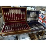 Two antique wooden cases of cutlery, one containing an EPNS set of fish knives and forks for 18, the