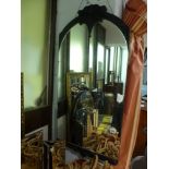 A stylish rectangular mirror with black wooden frame with scrolling decoration. FOR DETAILS OF