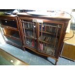 A handsome early 20th century mahogany bookcase with satinwood inlaid ends on cabriole legs a pair
