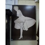 A framed black and white print of Marilyn Monroe in the 'Seven Year Itch' FOR DETAILS OF ONLINE