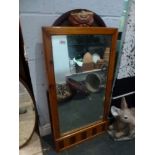 A pine-framed mirror. FOR DETAILS OF ONLINE BIDDING ON THIS LOT CONTACT BAINBRIDGES AND TO BOOK