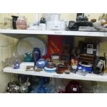 A shelf of assorted items including vintage games such as Snakes and Ladders and Halma, travel chess