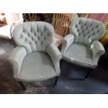 A pair of upholstered armchairs in buttoned velvet on square tapering legs. FOR DETAILS OF ONLINE