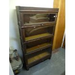 A four-section glazed American bookcase by Macey. FOR DETAILS OF ONLINE BIDDING ON THIS LOT