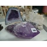 A large piece of natural amethyst hewn straight from the mine and sliced, another large piece of