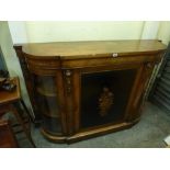 A Victorian walnut peer cabinet of stepped outline within an inlaid frieze above glazed door and