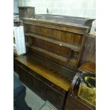 A good quality reproduction oak dresser the shelved superstructure above three drawers and three