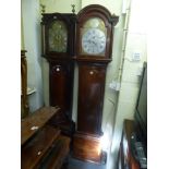 An early 19th century mahogany long-case clock the domed hood enclosing a steel and brass faced