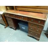 A good quality early 20th century mahogany knee-hole desk of nine drawers on bracket feet beneath