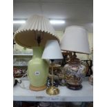 A large table lamp and shade in the Oriental manner, a green glazed table lamp and shade plus a