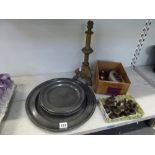 An antique pewter charger initialled RC, six antique pewter plates, a Victorian brass tripod