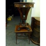 A splendid Victorian sewing table the octagonal hinged top revealing an original interior on four