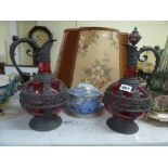 A pair of late 19th century German flagons with one stopper, in spelter-mounted cranberry glass,