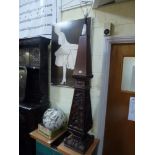 A substantial oak standard lamp carved with musical instruments and ribbons FOR DETAILS OF ONLINE