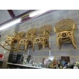 Four matching peacock armchairs in ornate raffia including one with rockers. [wall pegs] FOR DETAILS