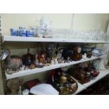 Two shelves of mixed items including ebony elephants, wooden ducks, an Edwardian mahogany inlaid