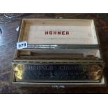 A Hohner double Chromatica mouth organ in original box [room] FOR DETAILS OF ONLINE BIDDING ON