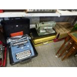 A Jones Electric Table Sewing Machine, an Olivetti Studio 46 Portable Typewriter and a carton of