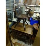An early 19th century mahogany bow-back desk chair, a 19th century writing table on tapering legs