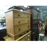 A 19th century small polished pine chest of three long drawers. FOR DETAILS OF ONLINE BIDDING ON