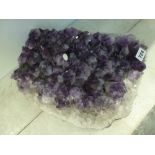 A massive fragment of amethyst geode, 15 in long [Y] FOR DETAILS OF ONLINE BIDDING ON THIS LOT