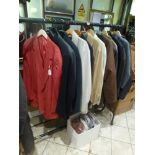 A half rail of men's good quality and designer suits and jackets, including a Donna Karan linen