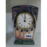 A modern Moorcroft mantel timepiece decorated with stylised trees, 6.2 in high [J] FOR DETAILS OF