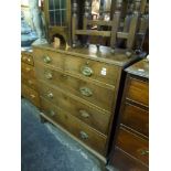 An early 19th century mahogany chest of two short over three long drawers on bracket feet. FOR