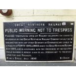 A late Victorian Great Northern Railway trespass sign in cast iron, dated King's Cross July 1896,