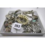 A large collection of silver and white metal, including a Tiffany silver necklet and charm, some