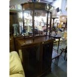 A furniture lot comprising a mahogany display cabinet with gothic glazed door, a hall table with two