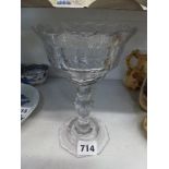 A Georgian sweetmeat glass with shallow cutting, shaped rim, faceted stem and octagonal foot, 7 in