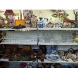 Two shelves of glassware including a pair of 19th century decanters and stoppers plus a more