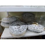 A 19th century part dinner service including a pair of tureens with elephant handles, a graduated