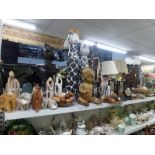 A mixed lot including soapstone figurines including elephants and cats, wooden elephants, cat