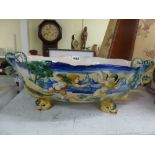 An Italian Cantagalli maiolica large oval bowl in Urbino style, painted with cupids, plain interior,