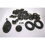 Whitby jet: a carved pendant and a carved brooch, two necklets, and two frames FOR DETAILS OF ONLINE