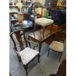 A Louis XV style centre table, possibly in cherry wood, with carved pierced frieze on cabriole