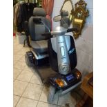 A Kymco Foru mobility scooter with battery and key [hall] FOR DETAILS OF ONLINE BIDDING ON THIS