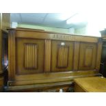A reproduction oak panelled coffer with moulded front decoration. FOR DETAILS OF ONLINE BIDDING ON
