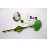 A 9 ct gold and three-stone brooch, a green stone single-stone ring and one earring, and a shell