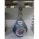 A modern Moorcroft limited edition bottle vase decorated with passion flowers, 1995, 233/300, 12.